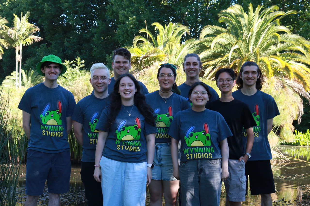 The whole Wynning Studios team in branded frog tees at the gardens